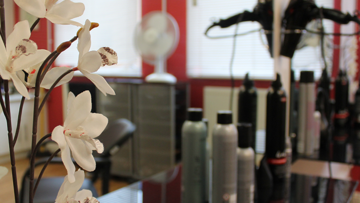 flowers and hair dryers in a salon