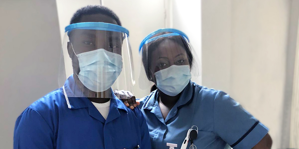 Two nurses in face visors