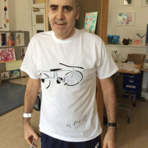 60 year old man wearing a tee he designed during his rehab from a brain injury