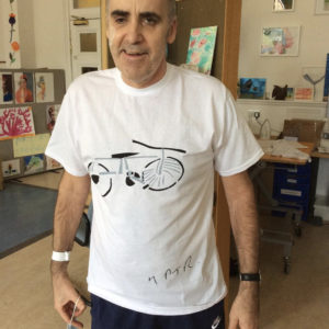 60 year old man wearing a tee he designed during his rehab from a brain injury