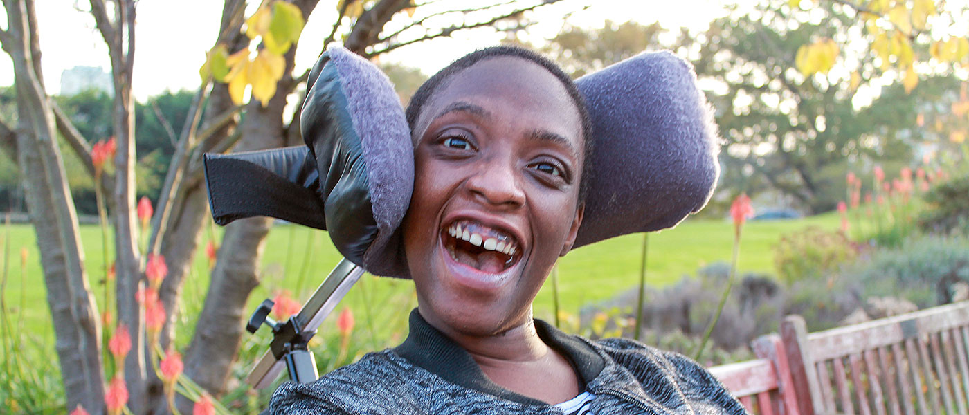 smiling black woman in wheelchair